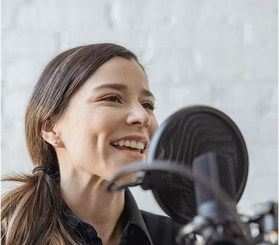Image of women talking into a microphone